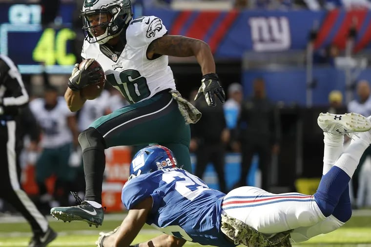 Eagles' Bryce Treggs, left, leaps over the Giants' Nat Berhe, right, during the 2nd quarter. Philadelphia Eagles play the New York Giants at MetLife Stadium in Rutherford, NJ on November 6, 2016. DAVID MAIALETTI / Staff Photographer