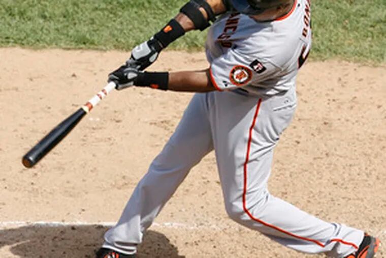 Barry Bonds connects on a three-run homer, No. 753 for his career.