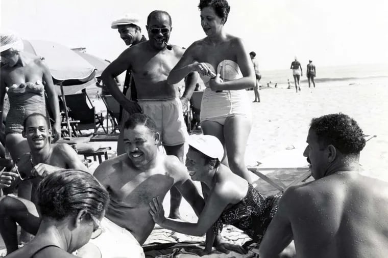 Heavyweight boxing champion Joe Louis (center) with friends on Chicken Bone Beach, Atlantic City (1952).