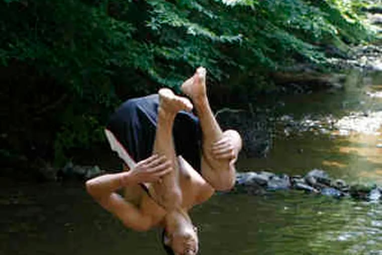 Before temperatures dipped , Jose Santiago dived, doing a back flip Sunday into a pond in the Brandywine Creek State Park area, near the Pennsylvania-Delaware state line.