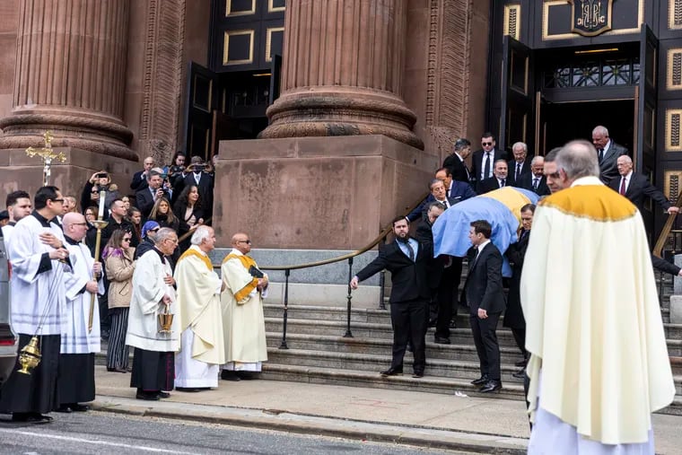 Draped in the Philadelphia flag, Jerry Blavat's casket is carried out towards the front of the Cathedral Basilica of Saints Peter and Paul to be loaded into the hearse. Blavat died Jan. 20.