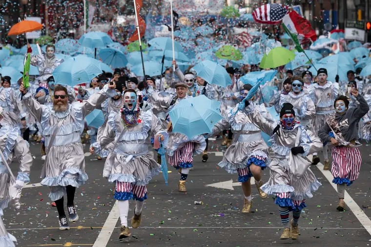 Members of the Froggy Carr Brigade strut down Market Street on Monday during the start of the 2024 Philadelphia Mummers Parade.