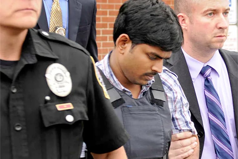 Raghunandan Yandamuri (center) has been charged in the deaths of a baby and her grandmother.