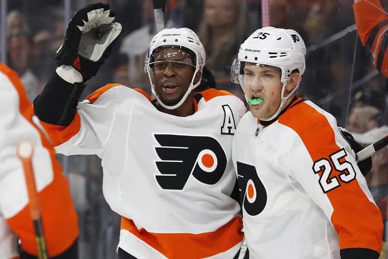 Wayne Simmonds celebrates with James van Riemsdyk (right) after scoring one of his goals against the Golden Knights on Thursday.