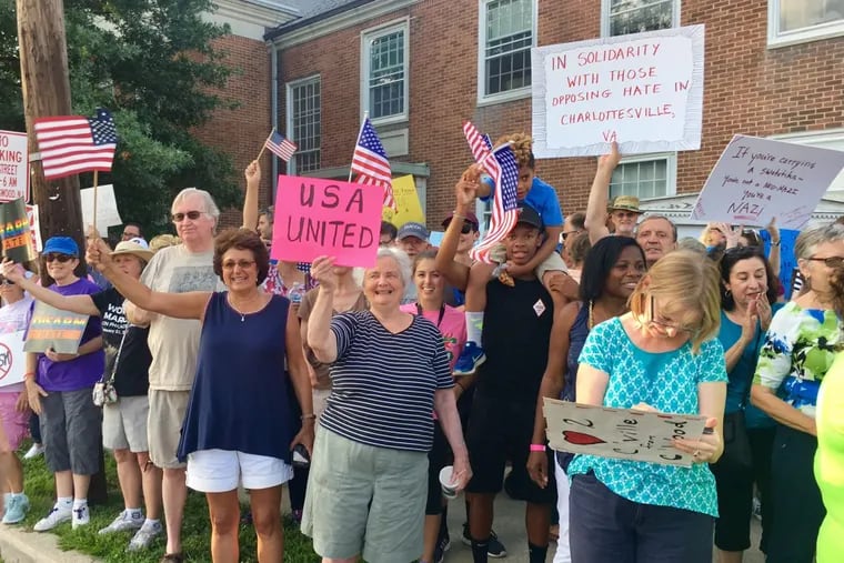 Several hundred people filled the corners of a Collingswood-Haddon Township, NJ intersection Sunday in a demonstration of support for the victims in Charlottesville, Va.