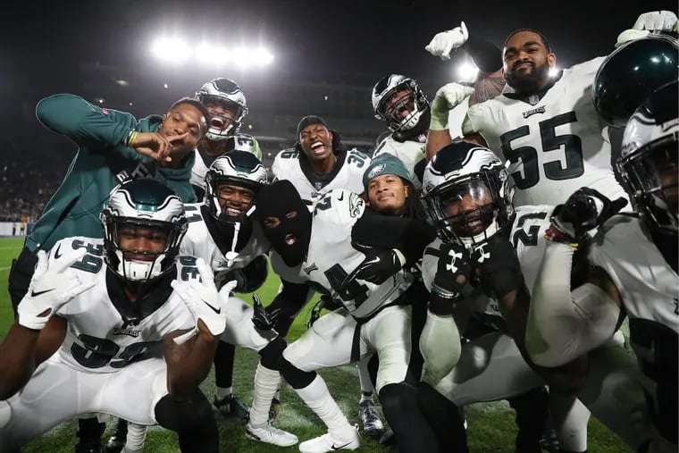 Eagles free safety Corey Graham wears a mask with his teammates after intercepting the football agains the Los Angeles Rams in the third-quarter on Sunday, December 16, 2018 in Los Angeles.