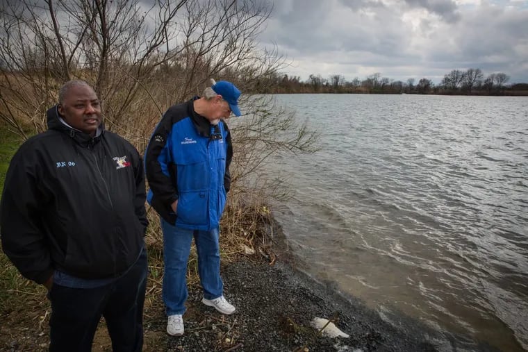 Avid anglers Rashawn Lewis, front left, and Fred Lentz, second from left, at the popular fishing spot known as DOD Ponds in Salem County, NJ. The secluded area is a popular fishing spot — and recently, gathering place for illegal drug users.