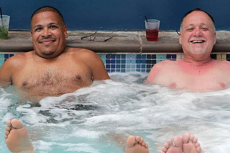 Carlos Flores (left) and Tom Wermuth, of Northeast Philadelphia, relax at Harrah's Resort. They were among attendees at Sand Blast's first year in Atlantic City after 13 in Asbury Park. (Akira Suwa/Staff)