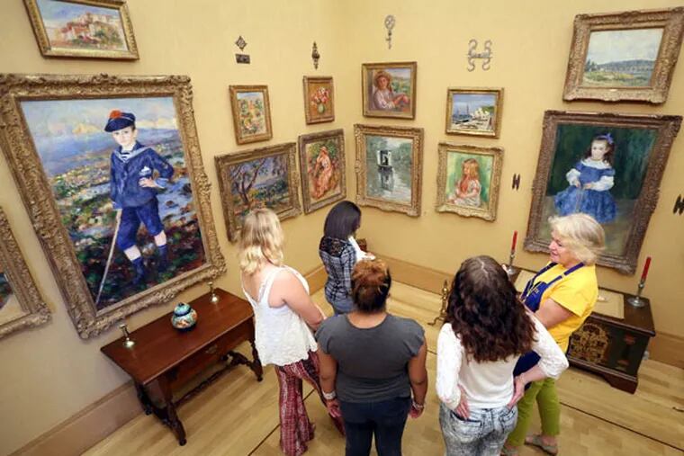 Girls from theVillage, a residential treatment facility, who have used art therapy as a way to heal from sexual, physical, and other abuse, at the Barnes Foundation. “It seems so calm and relaxing,” one said of a painting by Monet. (DAVID SWANSON / Staff Photographer)