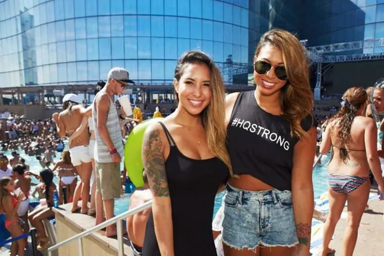 Bree Katherine (left) and Julianne Nicole pose during the final pool party for HQ Nightclub and Beach Club at the now-shuttered Revel Casino.