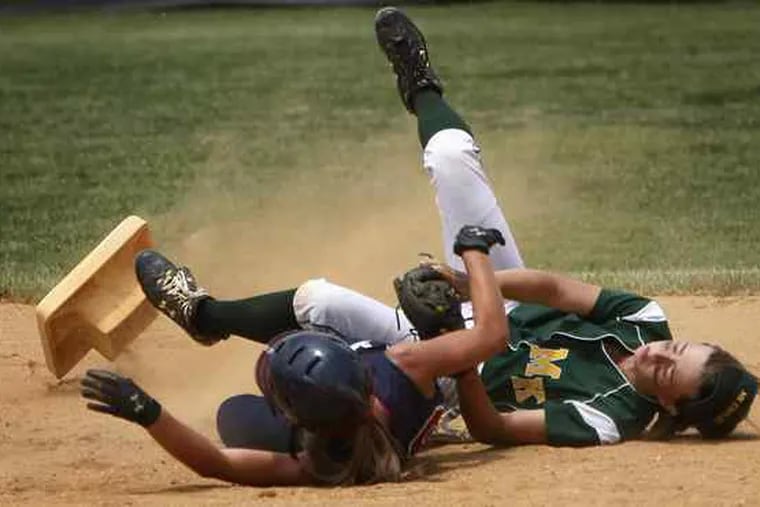 Second base goes flying as Eastern's Madison Tiernan (left) collides with Morris Knolls' Tori Clarke. Tiernan was out. Morris Knolls went on to win the Group 4 title.