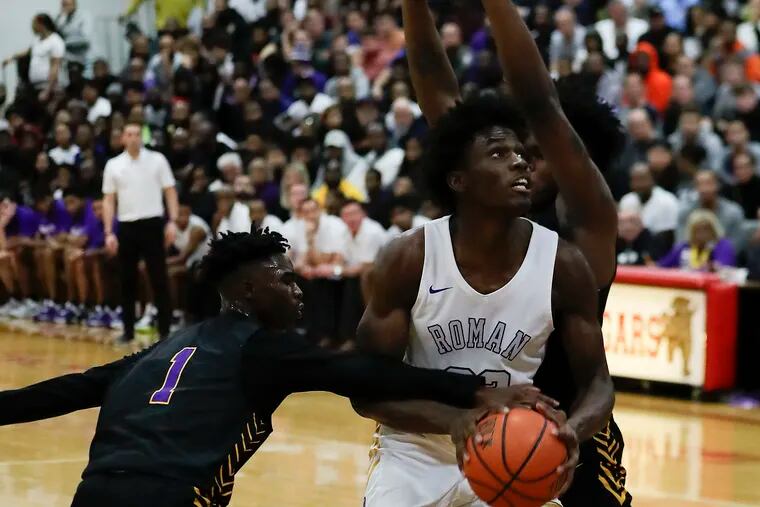 Jalen Duren (with basketball) generated 18 points with 17 rebounds in Roman Catholic's 70-59 win over Camden at the Dajuan Wagner Play-by-Play Classic at Cherry Hill East.