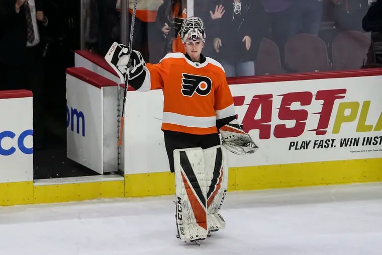 Carter Hart takes a bow as the star of the game against the Red Wings.