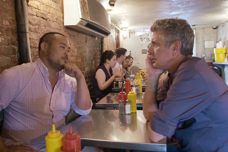 David Chang (left) and Anthony Bourdain sharing a moment in Morgan Neville's documentary, "Roadrunner."