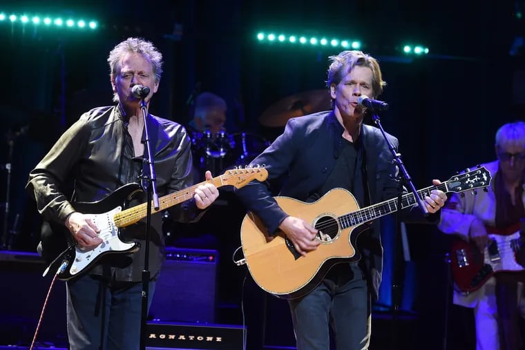 Kevin Bacon (on the right) with his brother Michael of the Bacon Brothers performing in New York in 2018. Kevin Bacon has posted a cover of Beyonce's single "Texas Hold 'Em" on Instagram. (Jamie McCarthy/Getty Images for God's Love We Deliver/TNS)