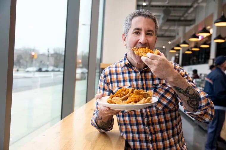Michael Solomonov, chef and co-owner of Zahav, chowing down on some chicken schnitzel.