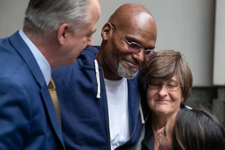 Willie Veasy, center, hugs his team of lawyers, Jim Figorski, left, Marissa Bluestine, right, and Nilam Sanghvi, bottom right, after he left the Center for Criminal Justice as a free man for the first time in 27 years following his exoneration on Oct. 09, 2019.