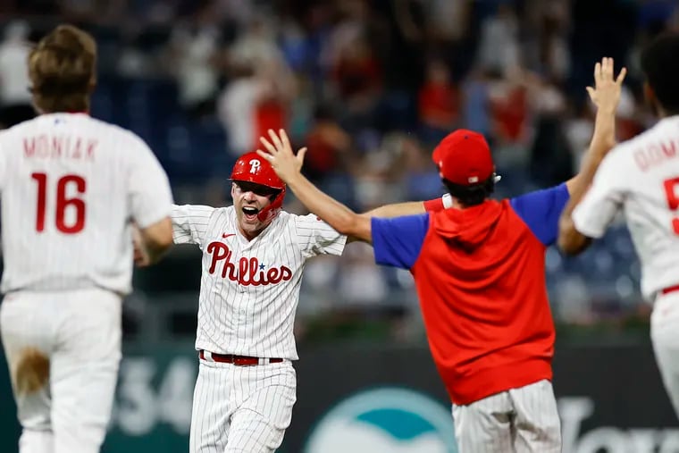 Phillies Rhys Hoskins celebrates his game winning hit with his teammates against the Miami Marlins on Monday, June 13, 2022 in Philadelphia.