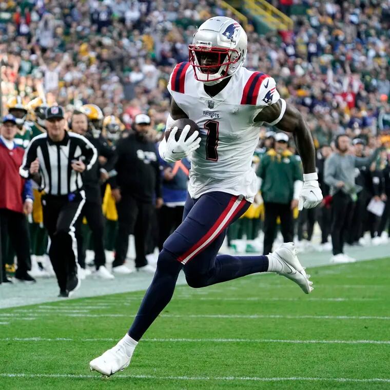 New England Patriots wide receiver DeVante Parker (1) scores on a 25-yard touchdown reception during the second half of an NFL football game against the Green Bay Packers, Sunday, Oct. 2, 2022, in Green Bay, Wis. (AP Photo/Morry Gash)