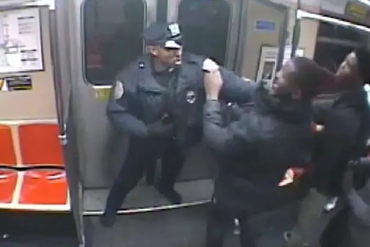 Subway car surveillance video shows SEPTA Officer Kevin Hackett holding Yaz by the collar during an altercation.