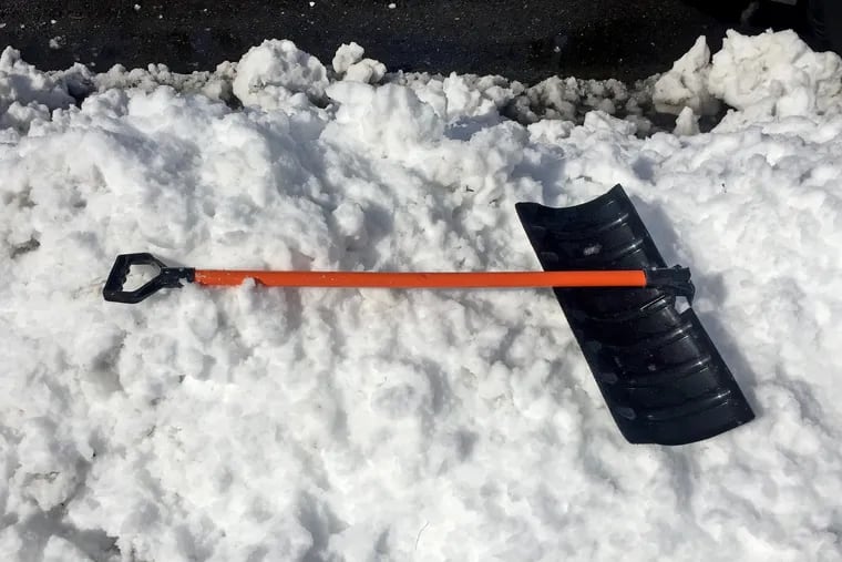 A defeated shovel after the early-March snowstorm after that balmy February.