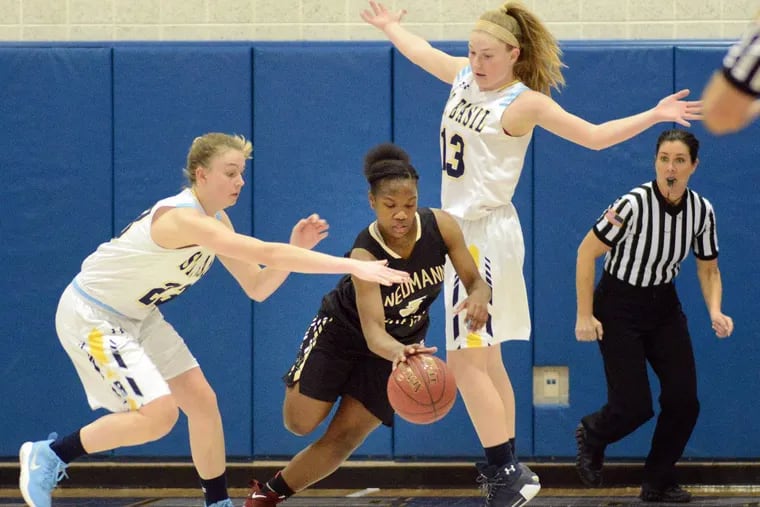 Neumann-Goretti's Diamond Johnson #5 steals the ball away from St. Basil's Casey Remolde #23 and Cheryl Remolde #13 St. Basil's in the second quarter of a PIAA Class 3A girls basketball playoff Friday, March 16, 2018 at Bensalem High School in Bensalem, Pennsylvania. WILLIAM THOMAS CAIN/For The Inquirer