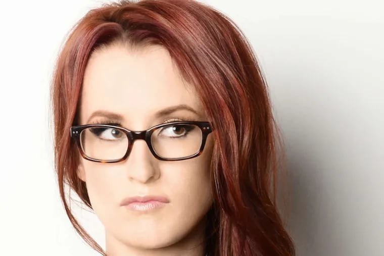Ingrid Michaelson performed wearing her signature wide, rectangular glasses, a staple of her sleek aesthetic.