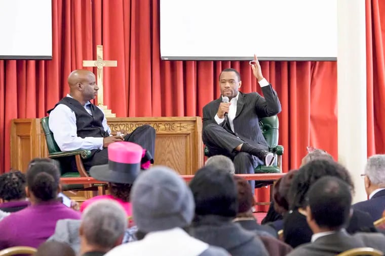 National journalist and political commentator Dr. Marc Lamont Hill (right) discussed his experiences in Ferguson, Missouri, at Mother Bethel AME Church. Mother Bethel’s Pastor Rev. Dr. Mark Kelly Tyler (left) led the conversation with Hill.