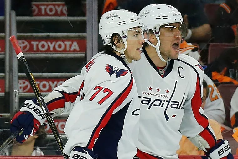 The Capitals' Alex Ovechkin celebrates his second-period goal with teammate T.J. Oshie against the Flyers.
