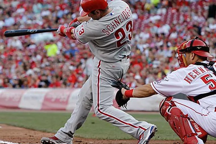 Brian Schneider hit a three-run home run in the second inning to spark the Phillies' offense. (AP Photo/Al Behrman)