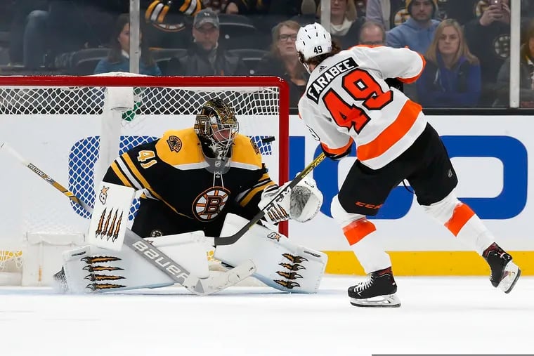 The Flyers' Joel Farabee (49) scores on Bruins goalie Jaroslav Halak (41) during the shootout.