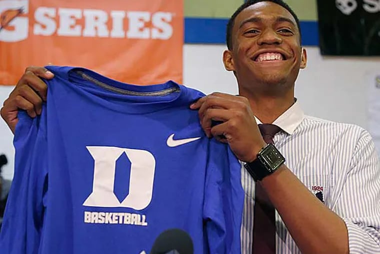 Chicago's Simeon Career Academy's Jabari Parker announces he will be attending Duke during a news conference at his high school Thursday, Dec. 20, 2012, in Chicago. (Charles Rex Arbogast/AP)