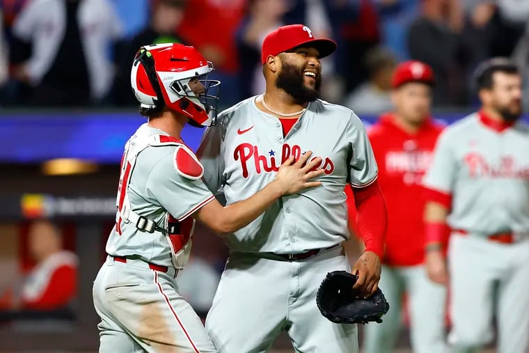 José Alvarado (right) picked up the save in the Phillies' comeback win over Mets.