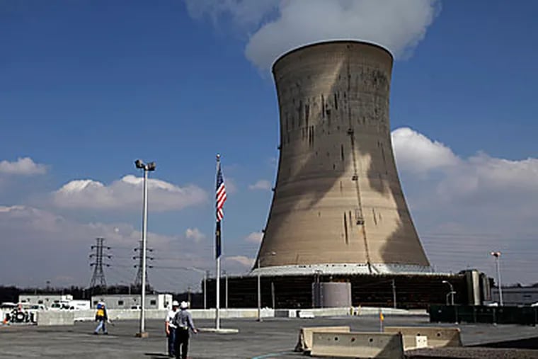 A cooling tower of Three Mile Island's Unit 1 Nuclear Power Plant is seen in Middletown, Pa. (AP Photo/Carolyn Kaster)