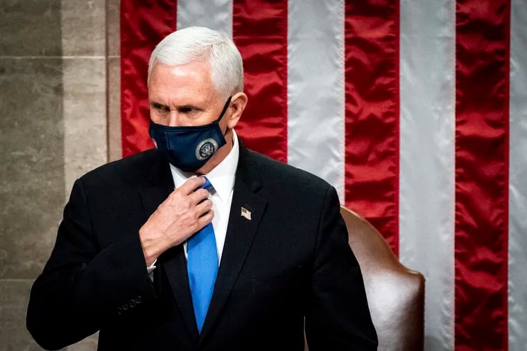Vice President Mike Pence officiates as a joint session of the House and Senate reconvenes to confirm the Electoral College votes at the Capitol, Wednesday, Jan 6, 2021.