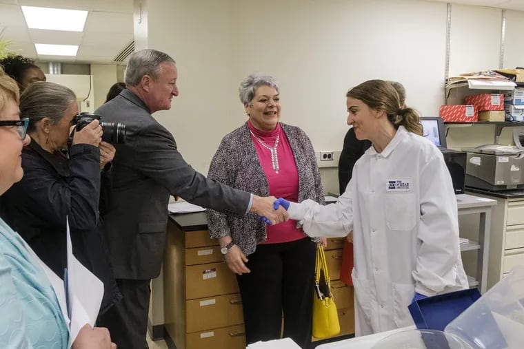 Mayor Jim Kenney and PA Labor Secretary Kathy Manderino meet biomedical technician trainee Amanda Moran as they joined administrators at the Wistar Institute for a tour to introduce a new biomedical research technician apprenticeship program. ED HILLE / Staff Photographer