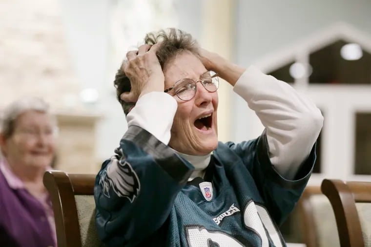 Sister Mary William Herron reacts while watching the Eagles lose to the Saints on Sunday with other Sisters of Saint Joseph Villa in Flourtown.