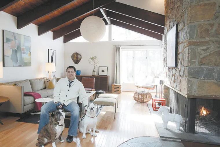 George Marrone with his dogs Sophie and Sasha in the living room. Themed-century-modern house was built in 1959 by an artist. January 23,2013. MICHAEL S. WIRTZ / Staff Photographer ).