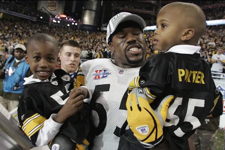 Steelers linebacker Joey Porter carried his sons Joey Jr. (left) and Jacob, after Super Bowl XL in 2006. The Steelers beat the Seattle Seahawks, 21-10.