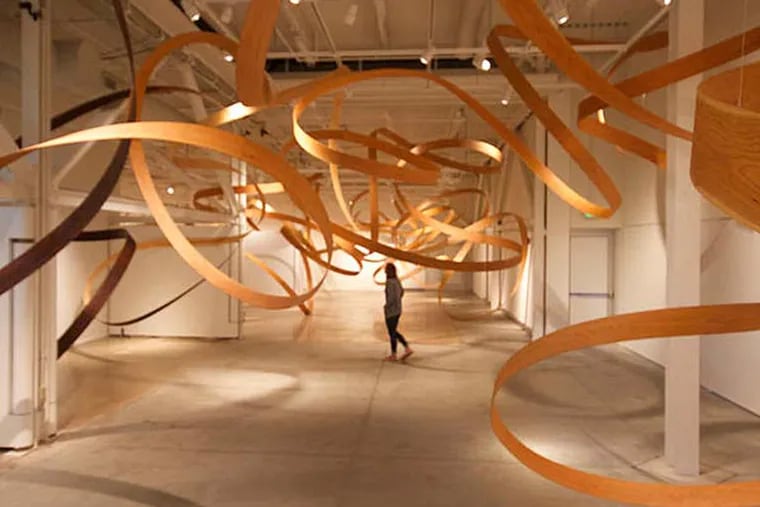 Jeremy Holmes' show "Convergence" marks his longest bentwood installation yet. (A.D. AMOROSI)