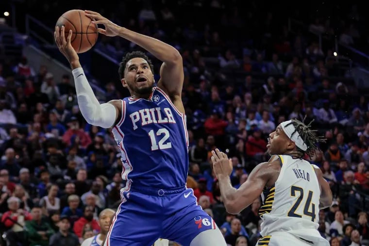 The Sixers' Tobias Harris grabs a rebound over the Pacers' Buddy Hield during the second quarter at the Wells Fargo Center.