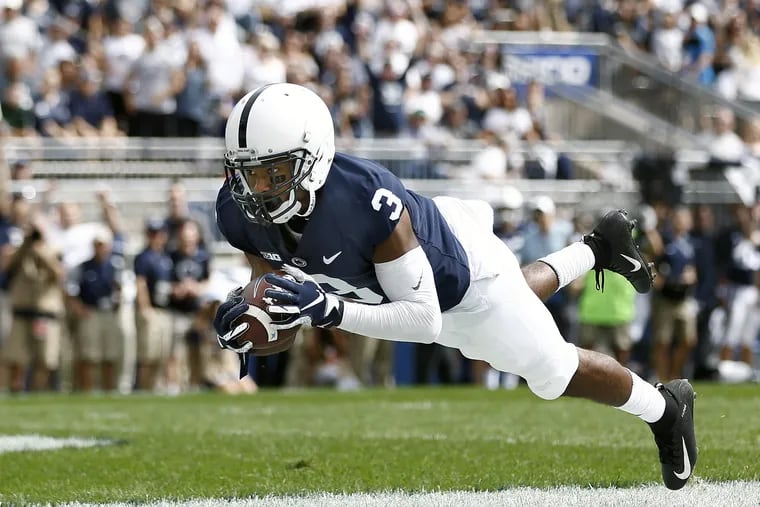 DeAndre Thompkins dives into the endzone to catch a touchdown pass against Kent State on Saturday.