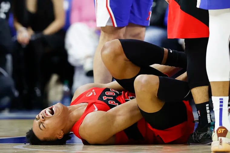 Toronto Raptors forward Scottie Barnes yells after injuring his leg during the fourth quarter against the Sixers during Game 1.