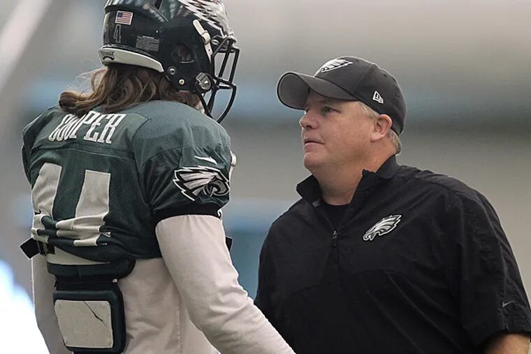Eagles head coach talks with wide receiver Riley Cooper at practice. (David Maialetti/Staff Photographer)