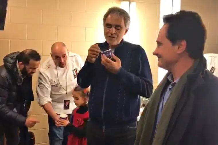 Andrea Bocelli (center) samples Desire gelato brought to his Wells Fargo Center dressing room by Gran Caffe L’Aquila owners (from left) Michele Morelli, Stefano Biasini, and Riccardo Longo.