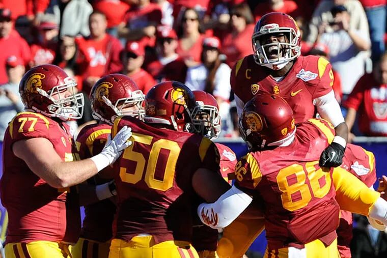 Southern California wide receiver Marqise Lee (9) celebrates with teammates after his 10-yard touchdown reception against Fresno State in the first quarter of the Royal Purple Bowl NCAA college football game, Saturday, Dec. 21, 2013, in Las Vegas. (David Cleveland/AP)