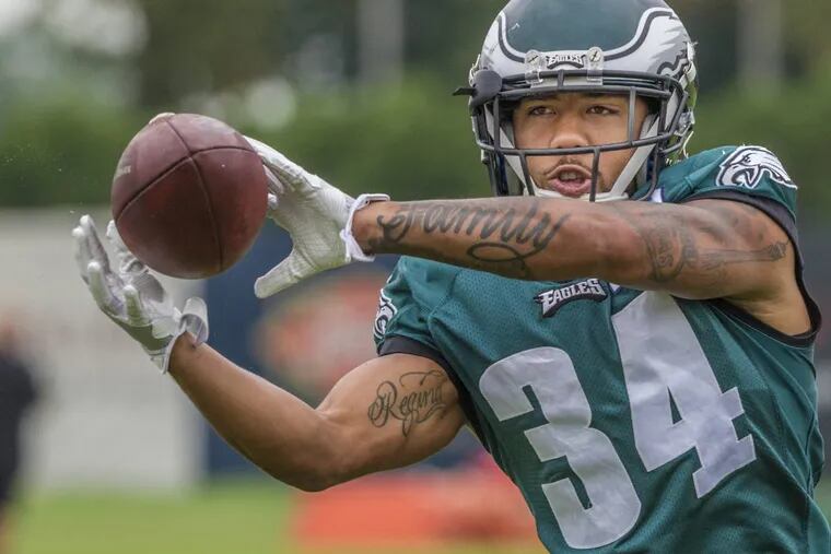 Eagles running back, Donnel Pumphrey, catches a pass in warmups before a practice.