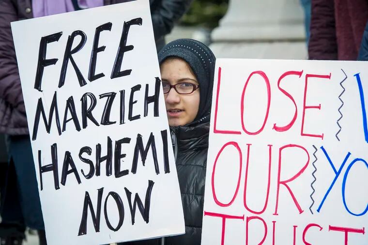Supporters of Marzieh Hashemi, an American-born anchor for Iran's state television broadcaster, demonstrate outside the federal courthouse where Hashemi will appear before a U.S. grand jury, Wednesday, Jan. 23, 2019, in Washington.  She is in custody as a material witness.