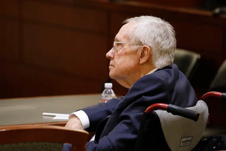Former U.S. Sen. Harry Reid sits in court Tuesday, March 26, 2019, in Las Vegas. A jury in Nevada heard opening arguments Tuesday in Reid's lawsuit against the maker of a flexible exercise band that he says slipped from his hand while he used it in January 2015, causing him to fall and suffer lasting injuries including blindness in one eye. (AP Photo/John Locher)