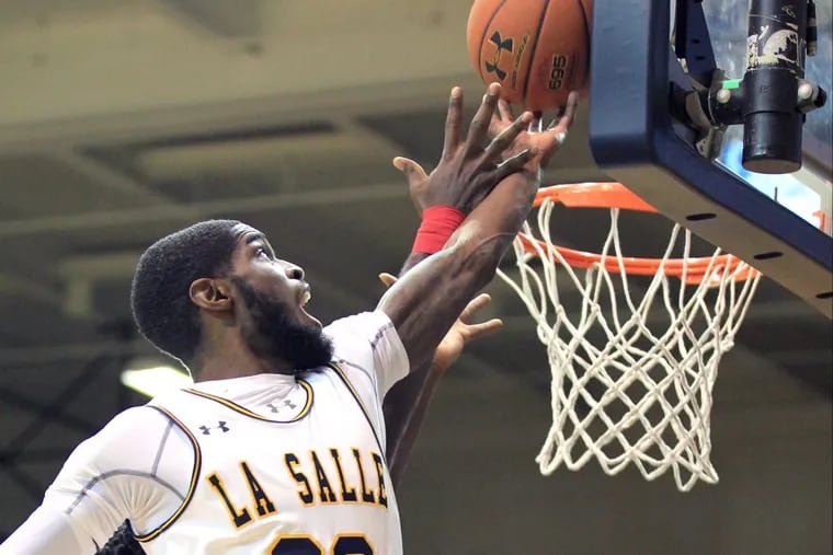B.J. Johnson of La Salle grabs a rebound in the first half against South Alabama at Tom Gola Arena.